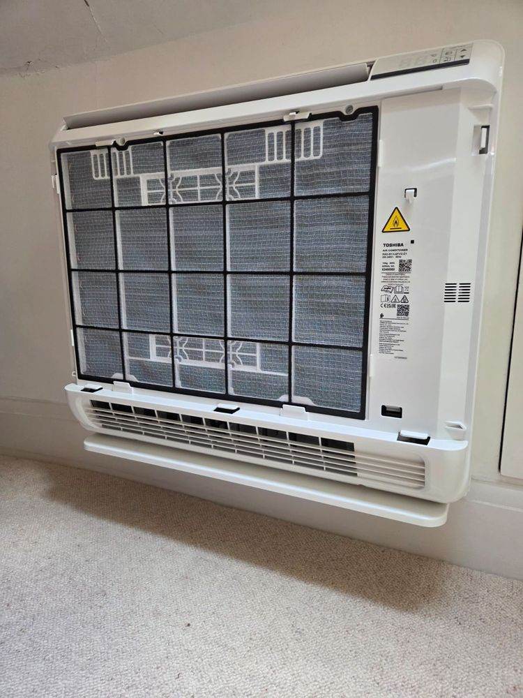 Filters removed and the coil exposed during a service